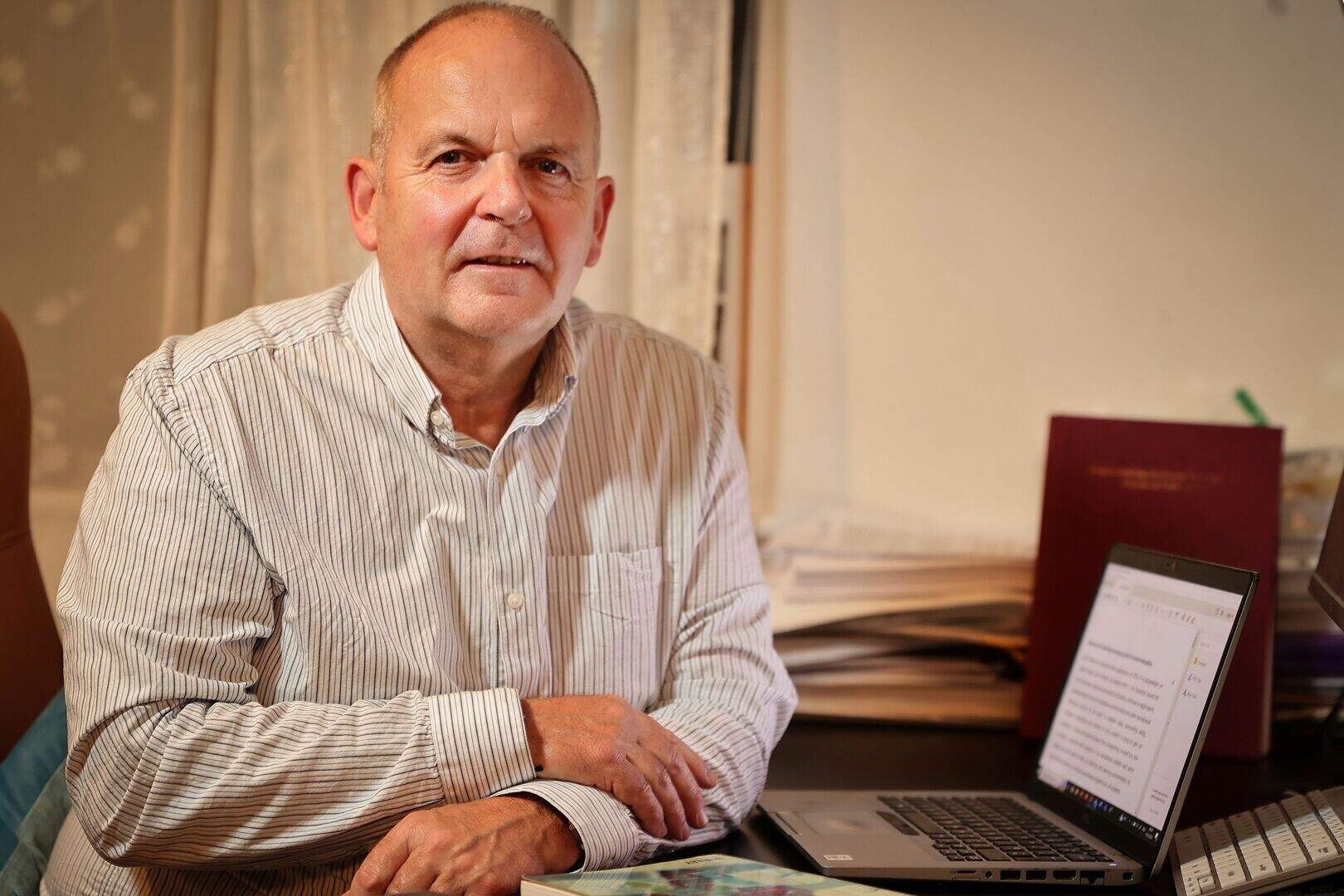 Dr. Keith Murphy seated at his desk.